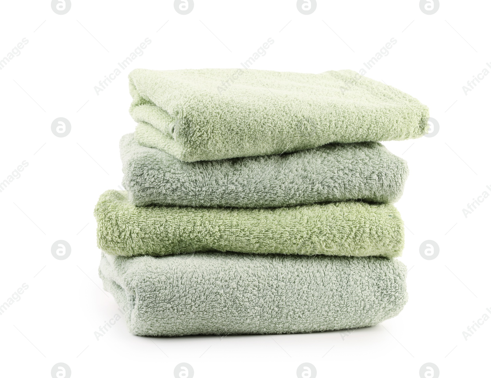 Photo of Stack of soft green towels isolated on white