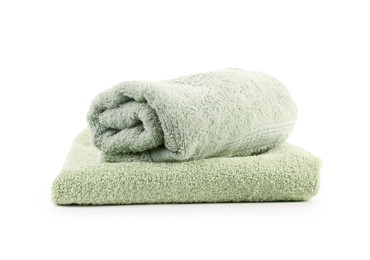 Photo of Green towels isolated on white. Home textile