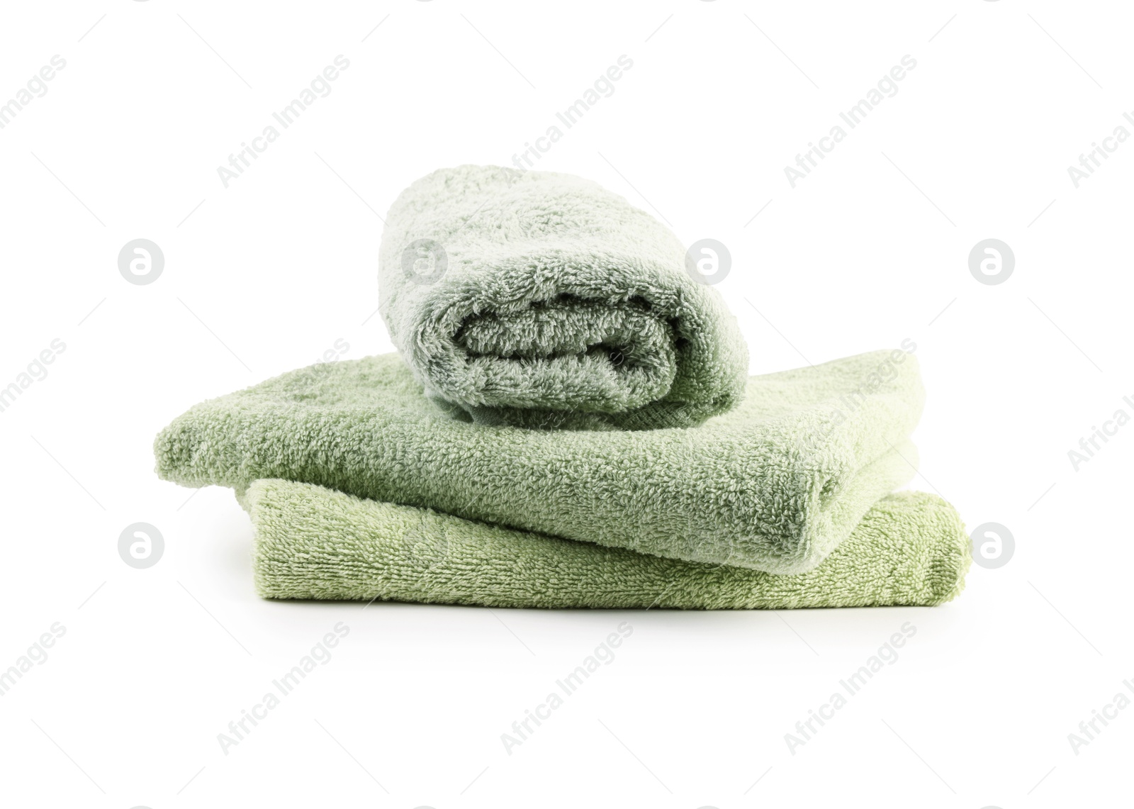 Photo of Green towels isolated on white. Home textile