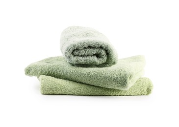 Photo of Green towels isolated on white. Home textile