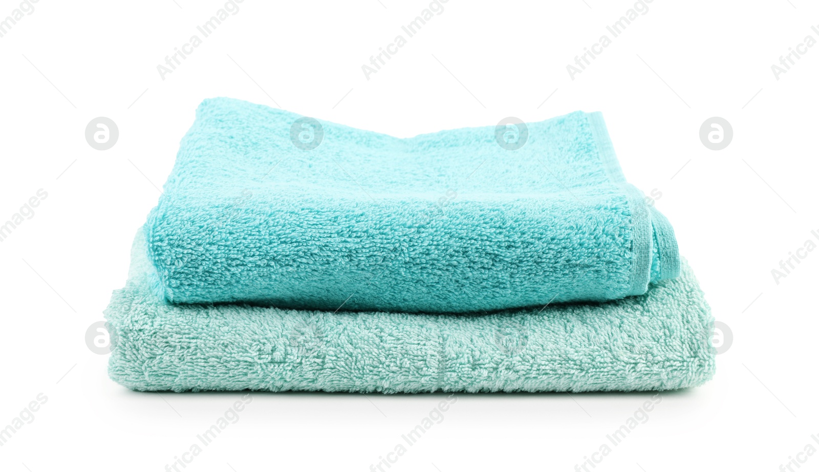 Stack of soft towels isolated on white Photo of Stack of soft towels isolated on white