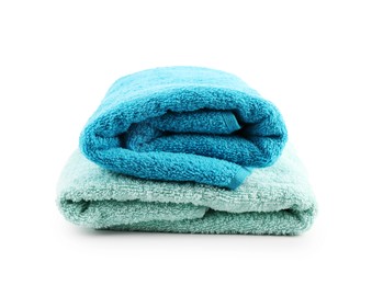 Photo of Folded soft towels isolated on white. Home textile