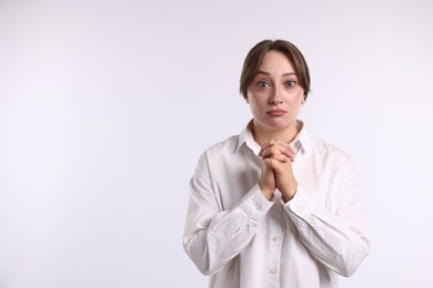 Photo of Woman apologizing on white background. Space for text