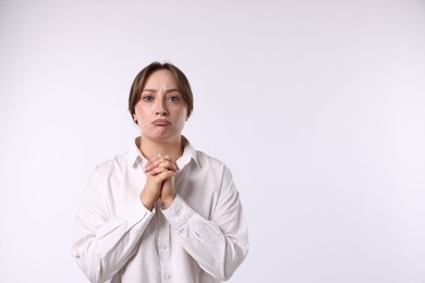 Photo of Woman apologizing on white background. Space for text