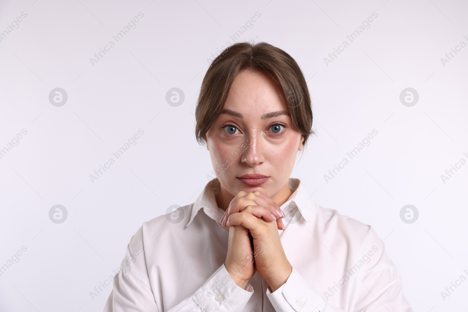 Portrait of woman apologizing on white background Photo of Portrait of woman apologizing on white background