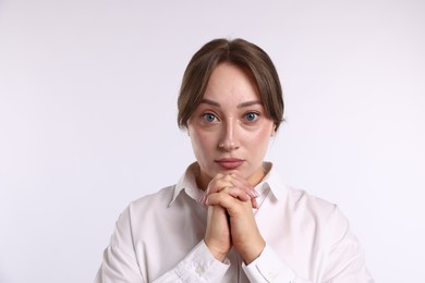 Photo of Portrait of woman apologizing on white background
