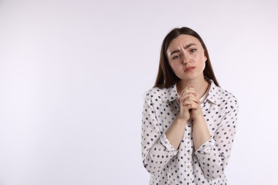 Photo of Woman apologizing on white background. Space for text