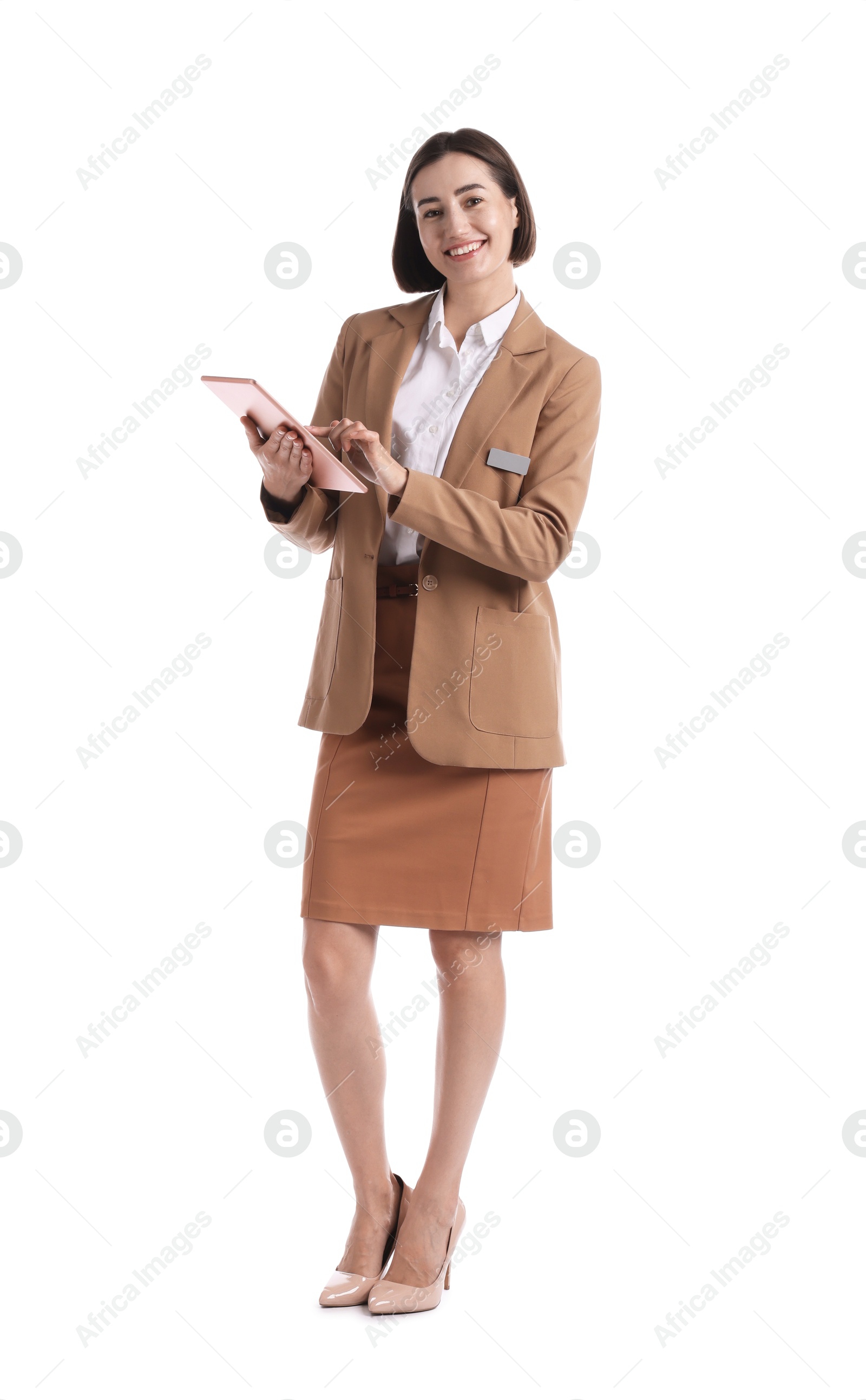 Smiling hostess in uniform using tablet on white background Photo of Smiling hostess in uniform using tablet on white background