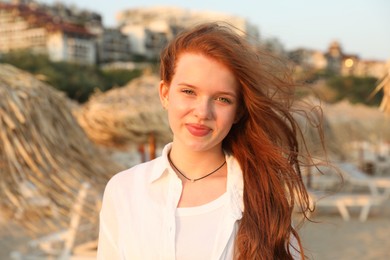 Photo of Portrait of beautiful teenage girl on beach