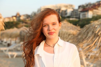 Photo of Portrait of beautiful teenage girl on beach