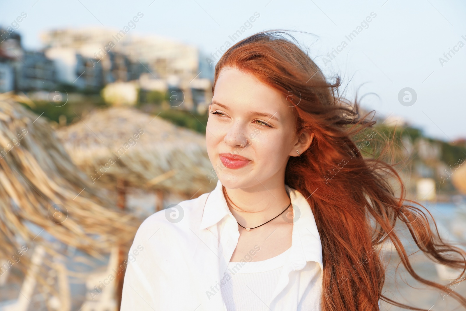 Photo of Portrait of beautiful teenage girl on beach
