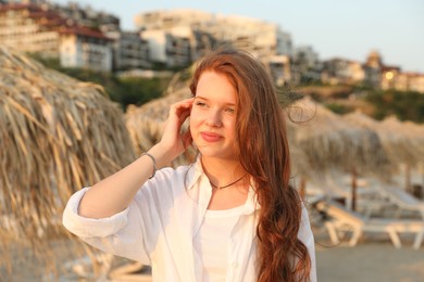 Photo of Portrait of beautiful teenage girl on beach