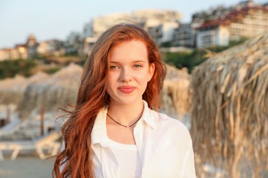 Photo of Portrait of beautiful teenage girl on beach