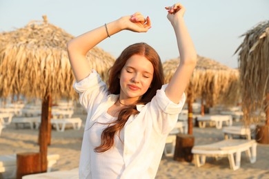Photo of Portrait of beautiful teenage girl on beach