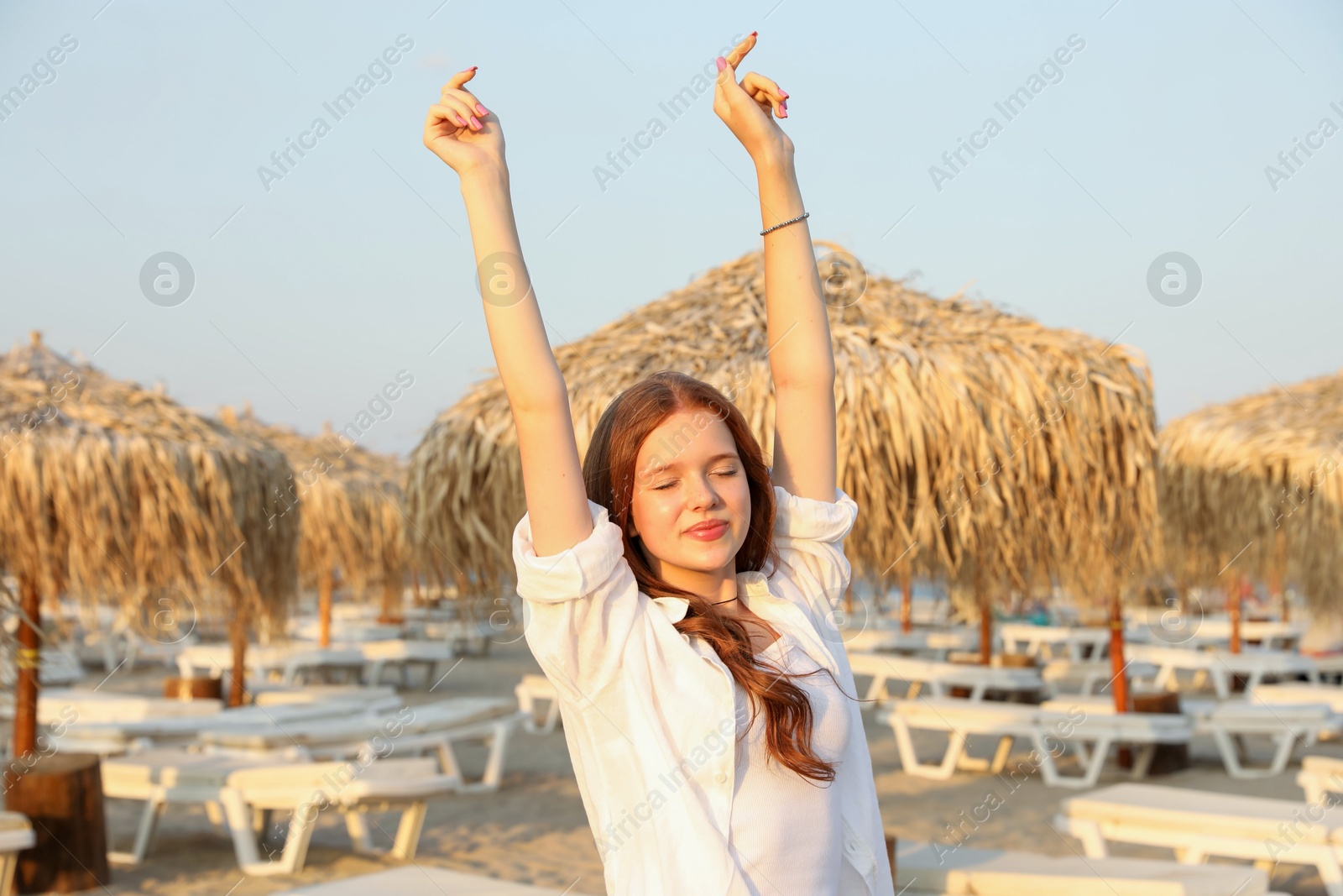 Photo of Portrait of beautiful teenage girl on beach
