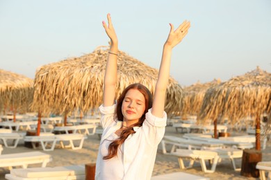 Photo of Portrait of beautiful teenage girl on beach