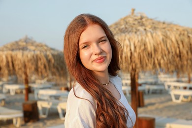 Photo of Portrait of beautiful teenage girl on beach