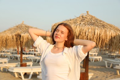 Photo of Portrait of beautiful teenage girl on beach
