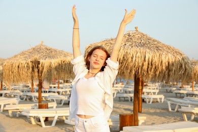 Photo of Portrait of beautiful teenage girl on beach