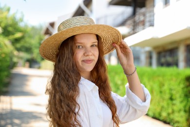 Photo of Beautiful girl in straw hat outdoors on sunny day