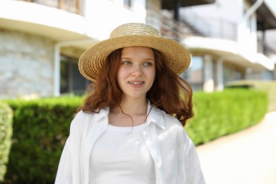 Photo of Beautiful girl in straw hat outdoors on sunny day