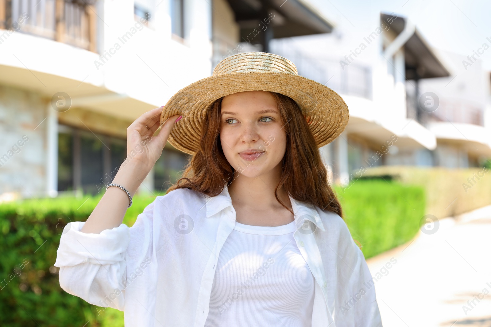 Beautiful girl in straw hat outdoors on sunny day Photo of Beautiful girl in straw hat outdoors on sunny day