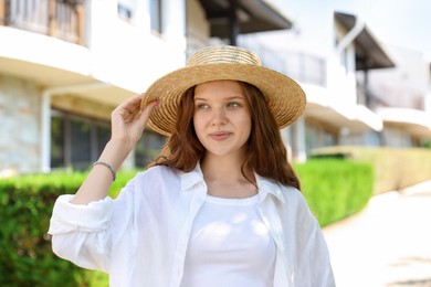 Photo of Beautiful girl in straw hat outdoors on sunny day