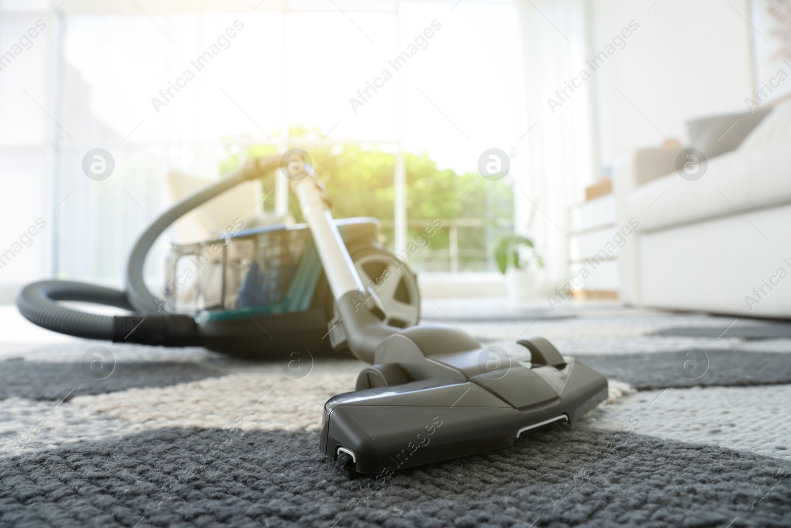 One vacuum cleaner on floor indoors, closeup. Household appliance Photo of One vacuum cleaner on floor indoors, closeup. Household appliance