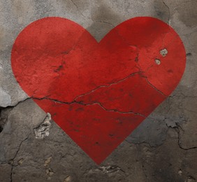 Image of Betrayal. Red heart on cracked old wall