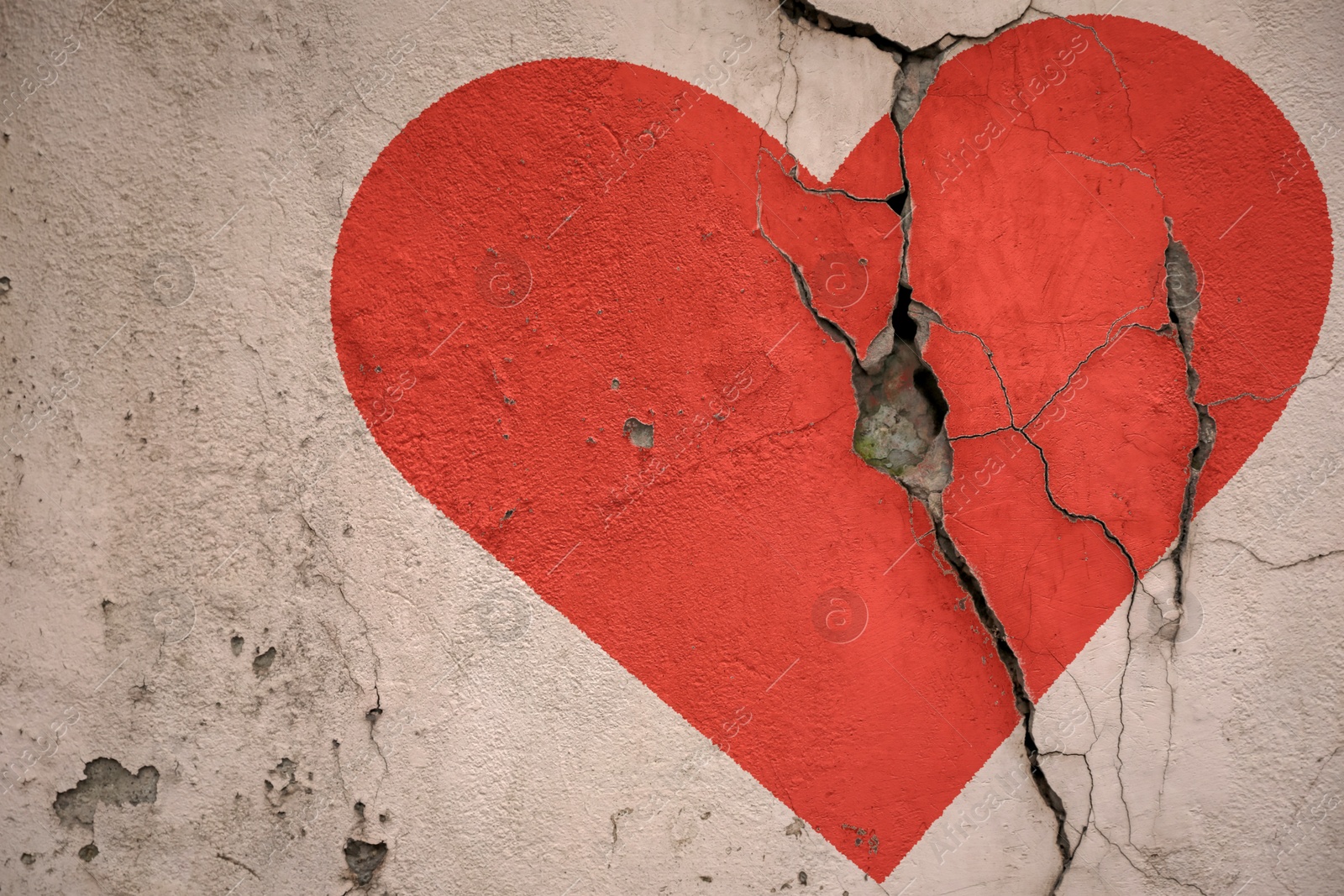 Betrayal. Red heart on cracked old wall Image of Betrayal. Red heart on cracked old wall