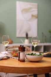 Photo of Dinner table with tasty food and white wine indoors