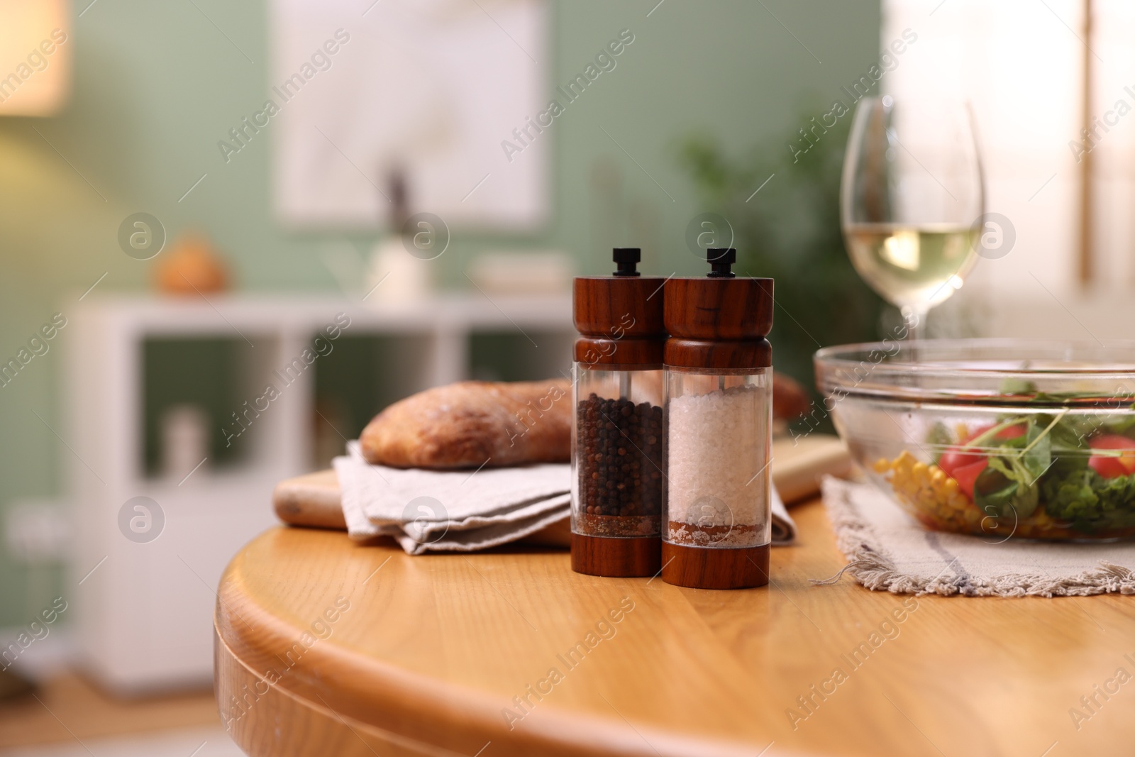 Tasty food and white wine on wooden table indoors, closeup Photo of Tasty food and white wine on wooden table indoors, closeup