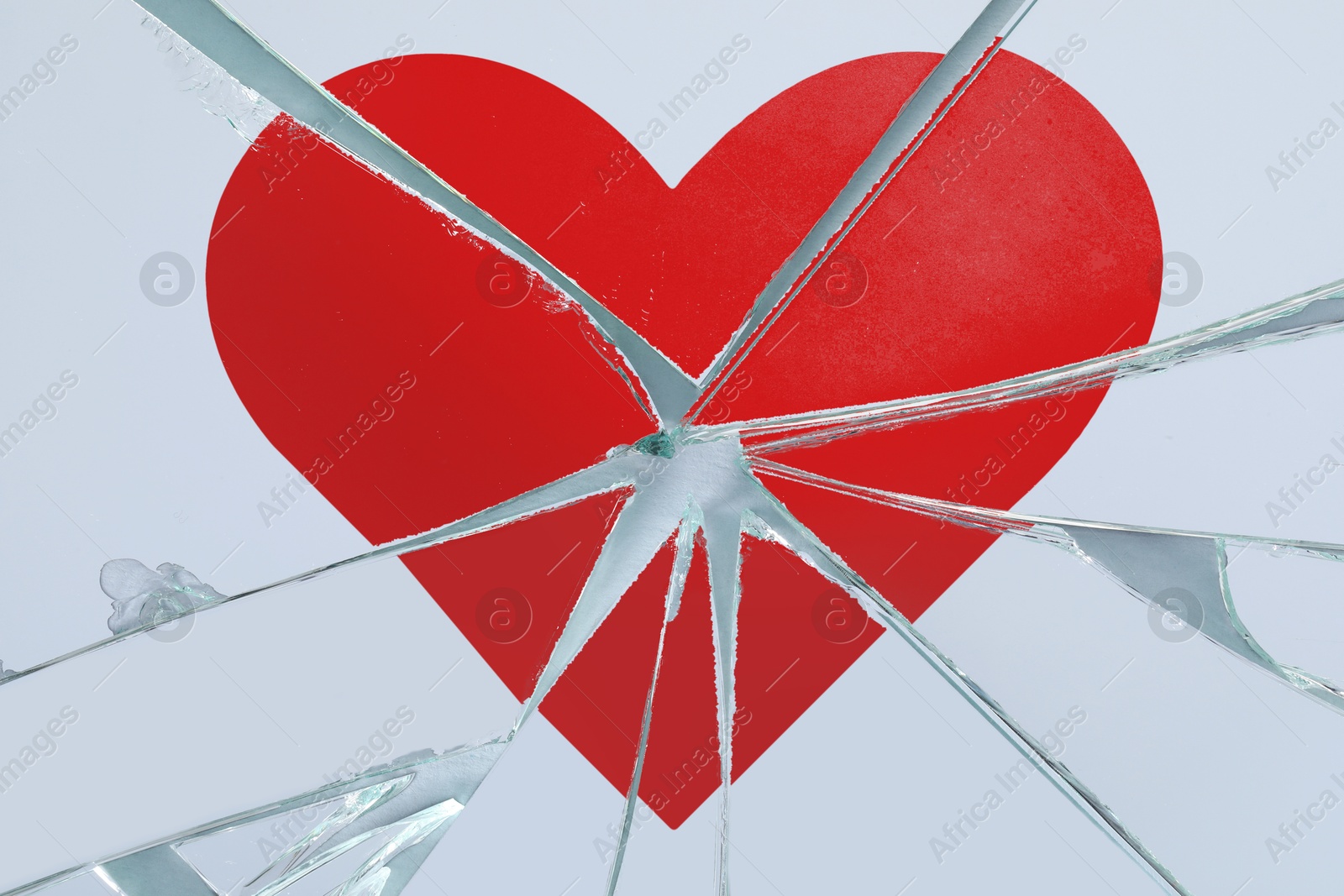Betrayal. Broken glass with red heart, top view Image of Betrayal. Broken glass with red heart, top view