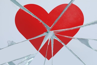 Image of Betrayal. Broken glass with red heart, top view