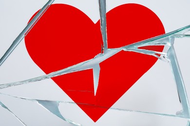 Image of Betrayal. Broken glass with red heart, top view