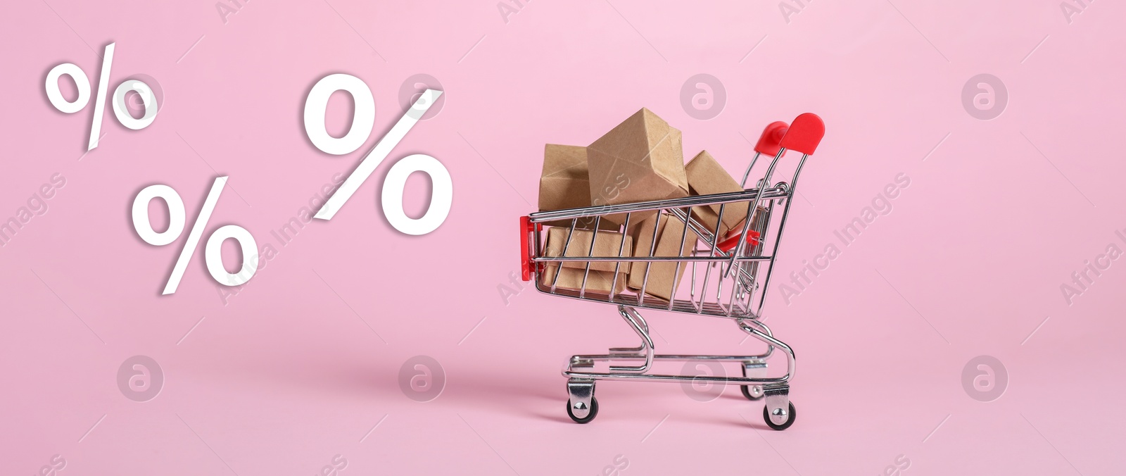 Hot sale, special offer. Percent signs flying near shopping cart with boxes against pink background Image of Hot sale, special offer. Percent signs flying near shopping cart with boxes against pink background