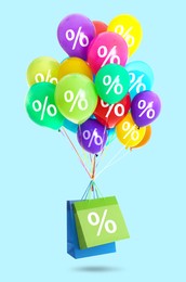 Image of Hot sale, special offer. Shopping bags and balloons with percent signs in air against light blue background