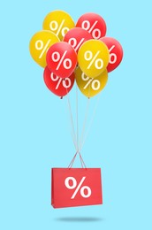 Image of Hot sale, special offer. Shopping bag and balloons with percent signs in air against light blue background