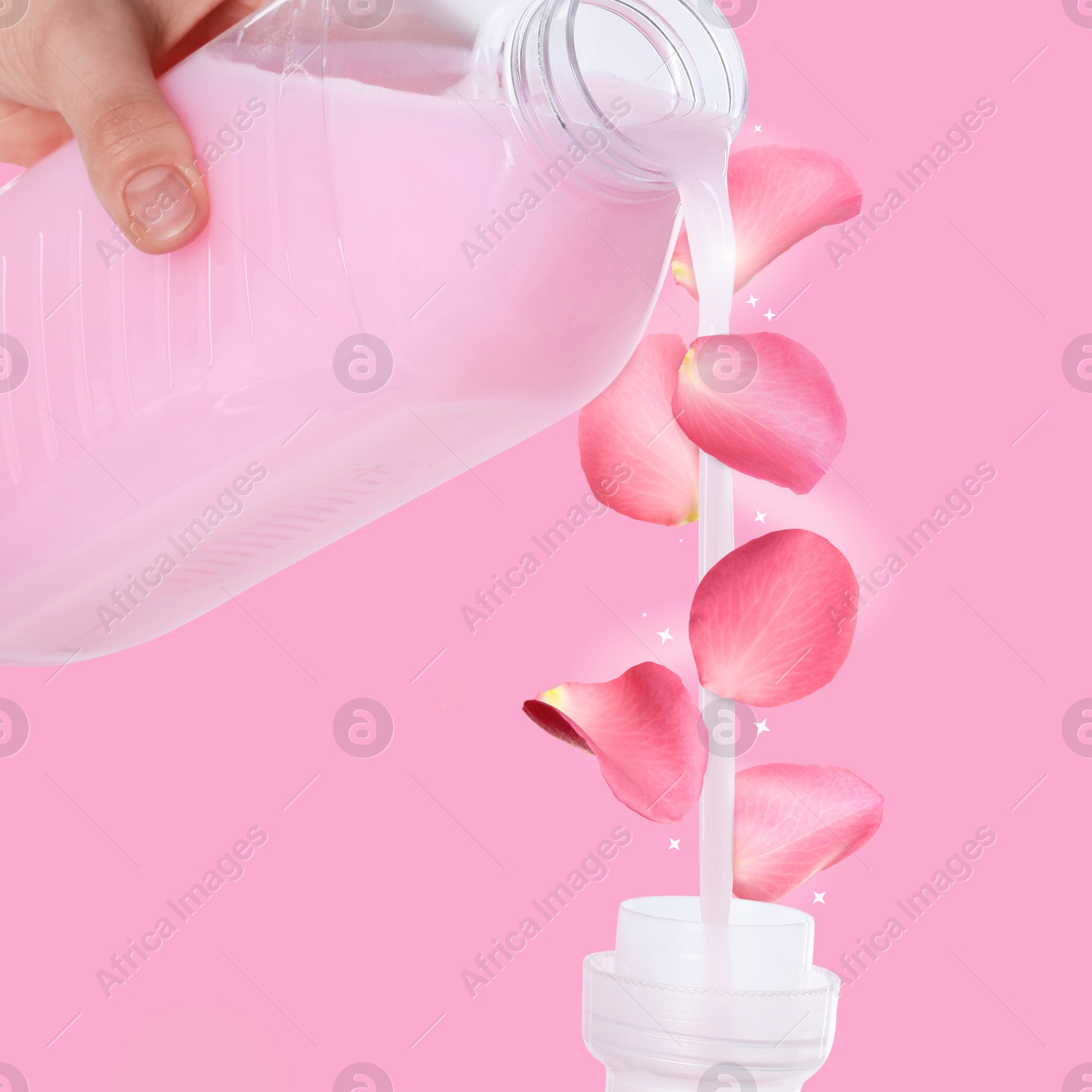 Fabric softener advertising poster. Woman pouring conditioner against pink background. Flower petals flying around stream of liquid Image of Fabric softener advertising poster. Woman pouring conditioner against pink background. Flower petals flying around stream of liquid