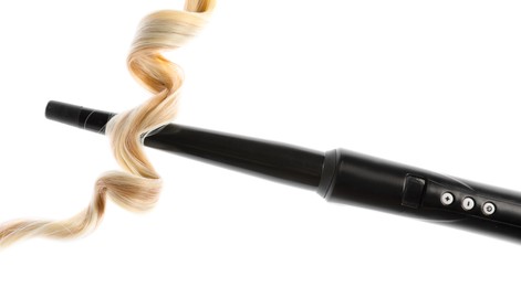 Photo of Curling iron with blonde hair lock isolated on white