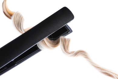 Photo of Straightener with blonde hair lock isolated on white