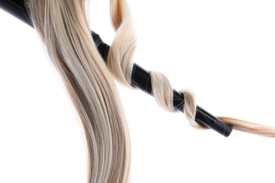 Photo of Curling iron with blonde hair lock isolated on white