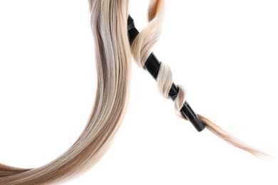 Photo of Curling iron with blonde hair lock isolated on white