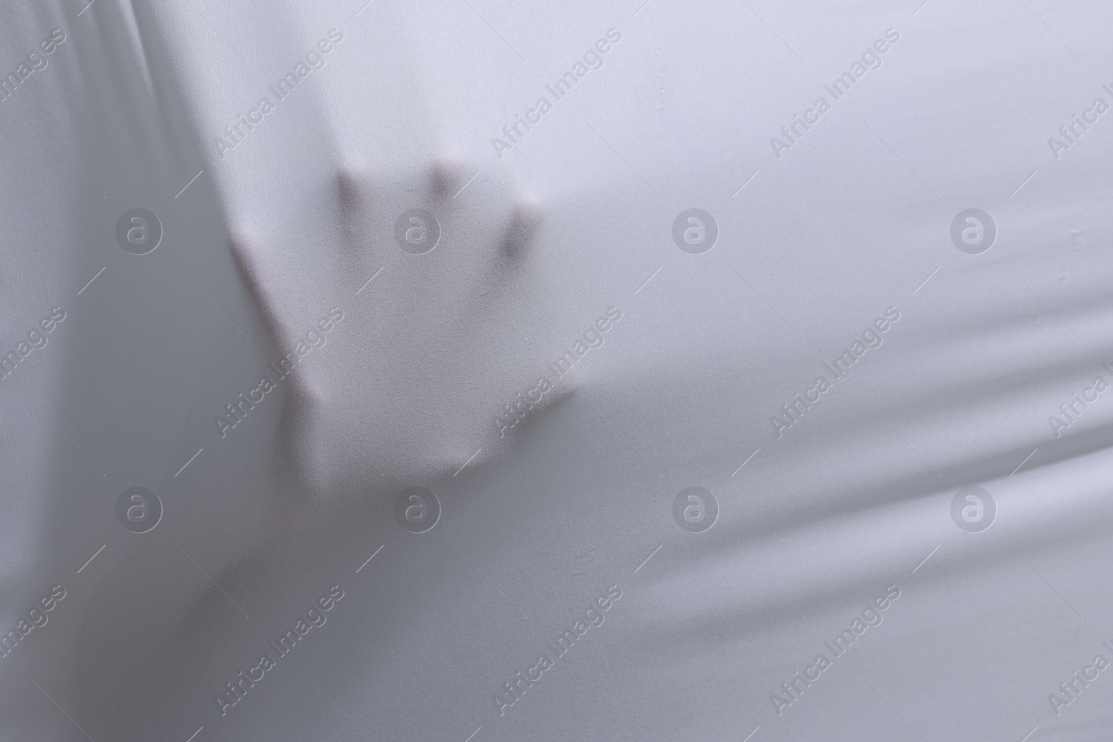 Creepy ghost behind white sheet, closeup. Space for text Photo of Creepy ghost behind white sheet, closeup. Space for text