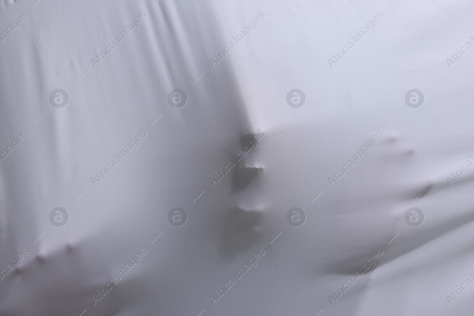 Silhouette of creepy ghost behind white sheet Photo of Silhouette of creepy ghost behind white sheet