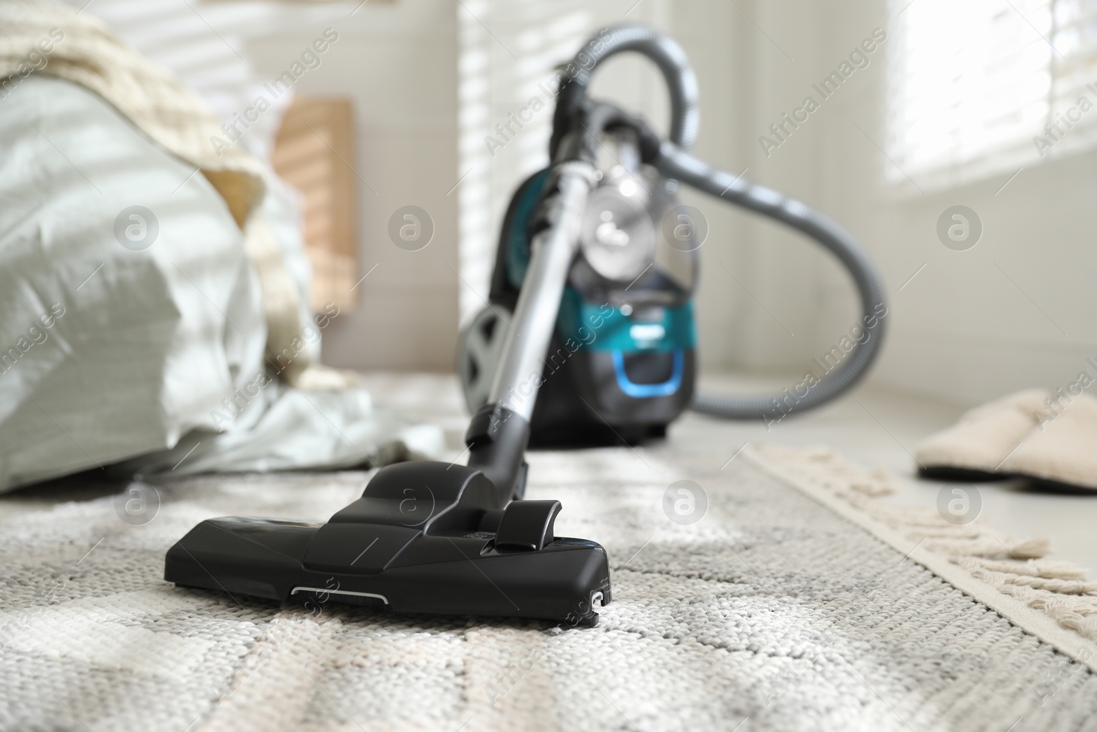 One vacuum cleaner on floor indoors, closeup Photo of One vacuum cleaner on floor indoors, closeup