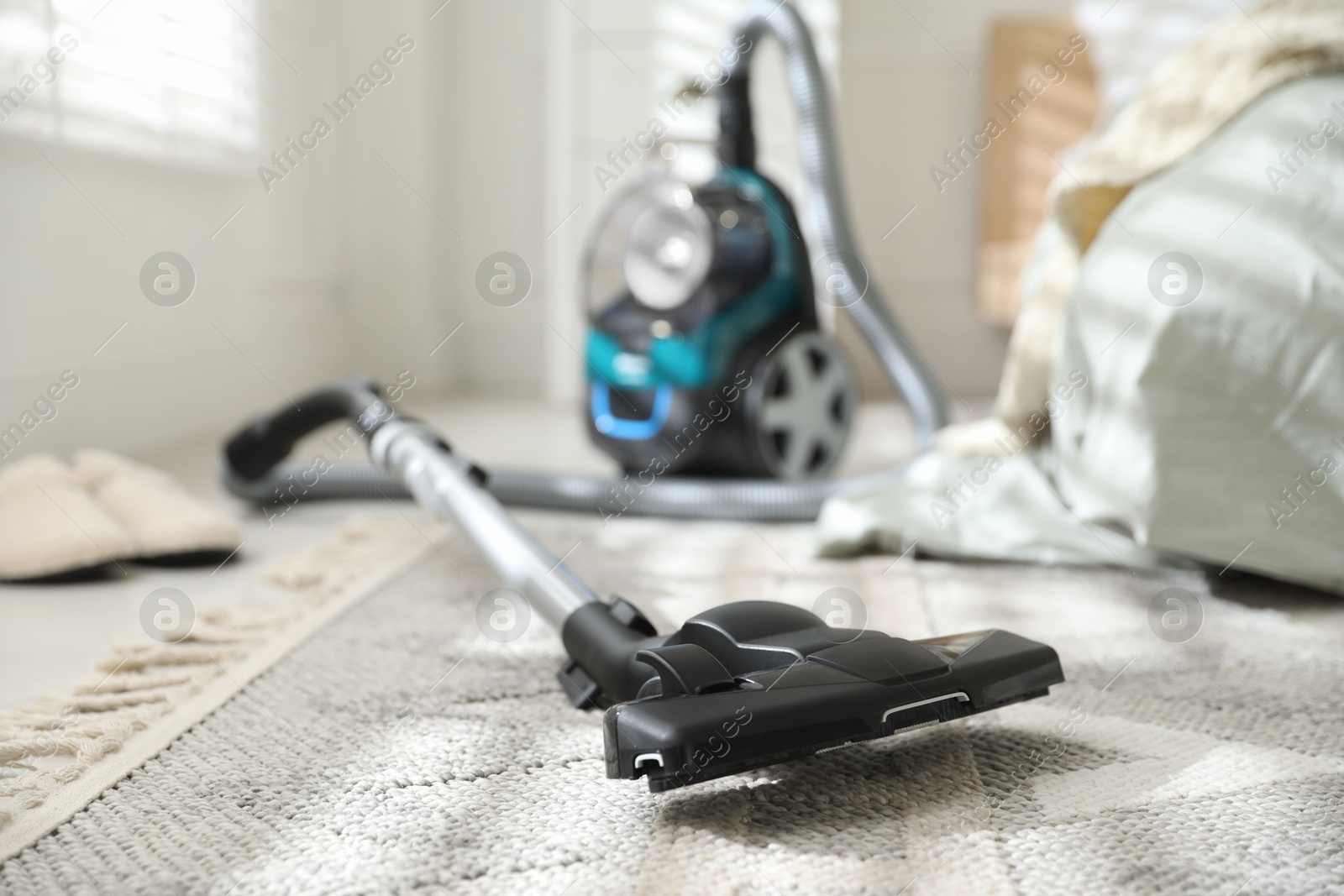 One vacuum cleaner on floor indoors, closeup Photo of One vacuum cleaner on floor indoors, closeup