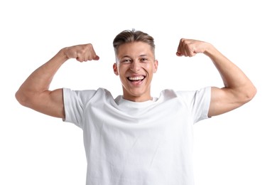 Photo of Strength. Happy man showing his biceps on white background