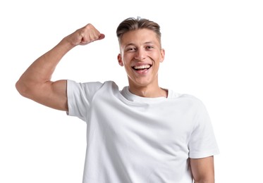 Photo of Strength. Happy man showing his biceps on white background