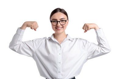 Photo of Strength. Happy businesswoman in glasses showing her biceps on white background
